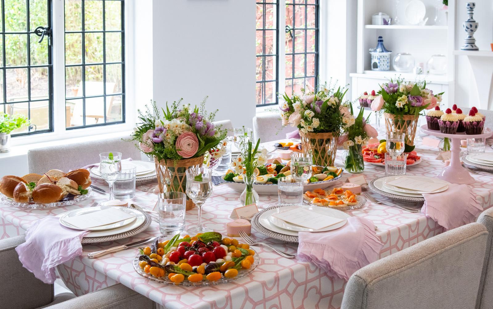 Full table setup with floral centerpieces and dishes